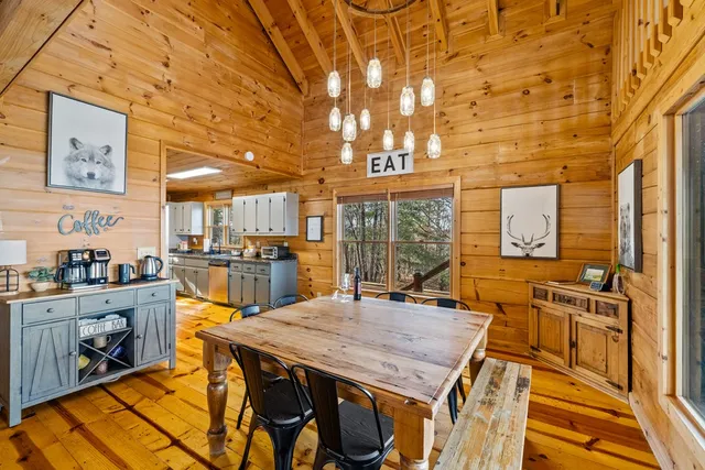 a dining room with a table and chairs