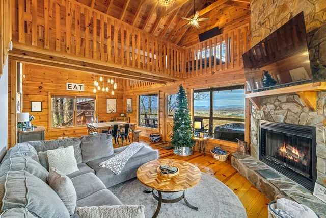 a view of a patio with couches chairs and a kitchen view