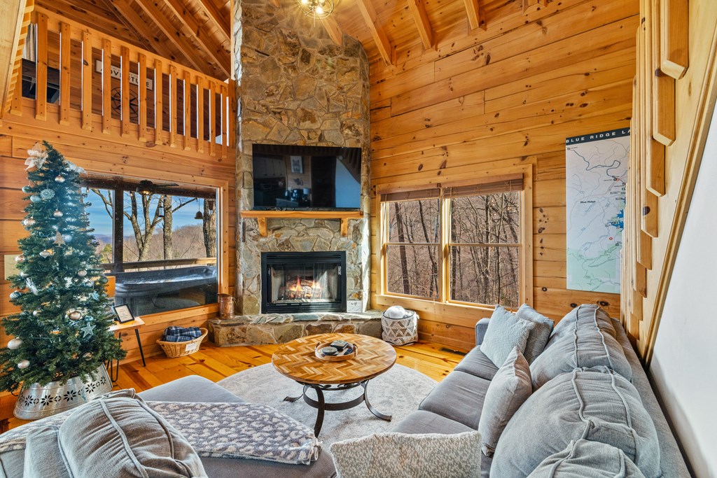 907 Ripshin Mountain Road Blue Ridge, GA 30513 - Photo 18 of 55 a view of a patio with couches chairs and a kitchen view