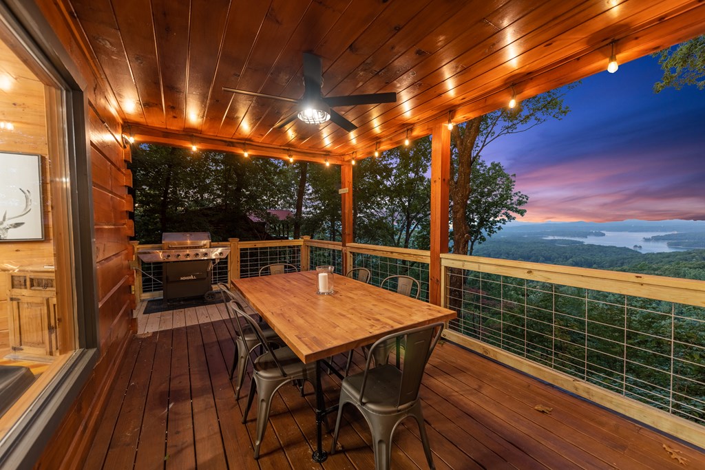 907 Ripshin Mountain Road Blue Ridge, GA 30513 - Photo 39 of 55 a view of a chairs and table on the wooden deck