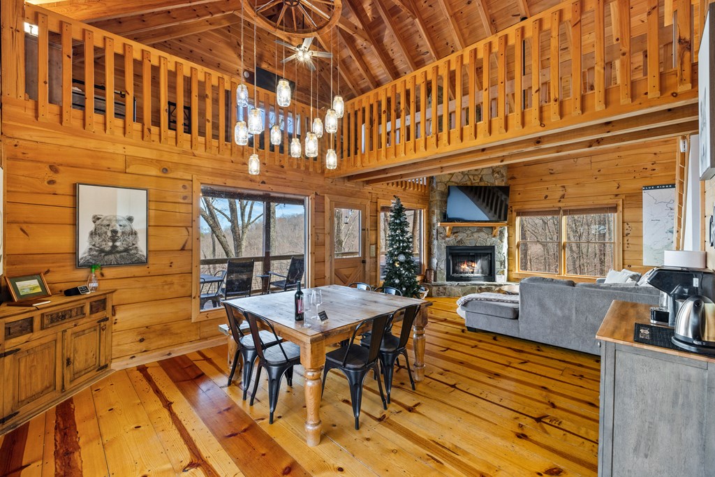 907 Ripshin Mountain Road Blue Ridge, GA 30513 - Photo 9 of 55 a view of a dining table and chairs in the patio