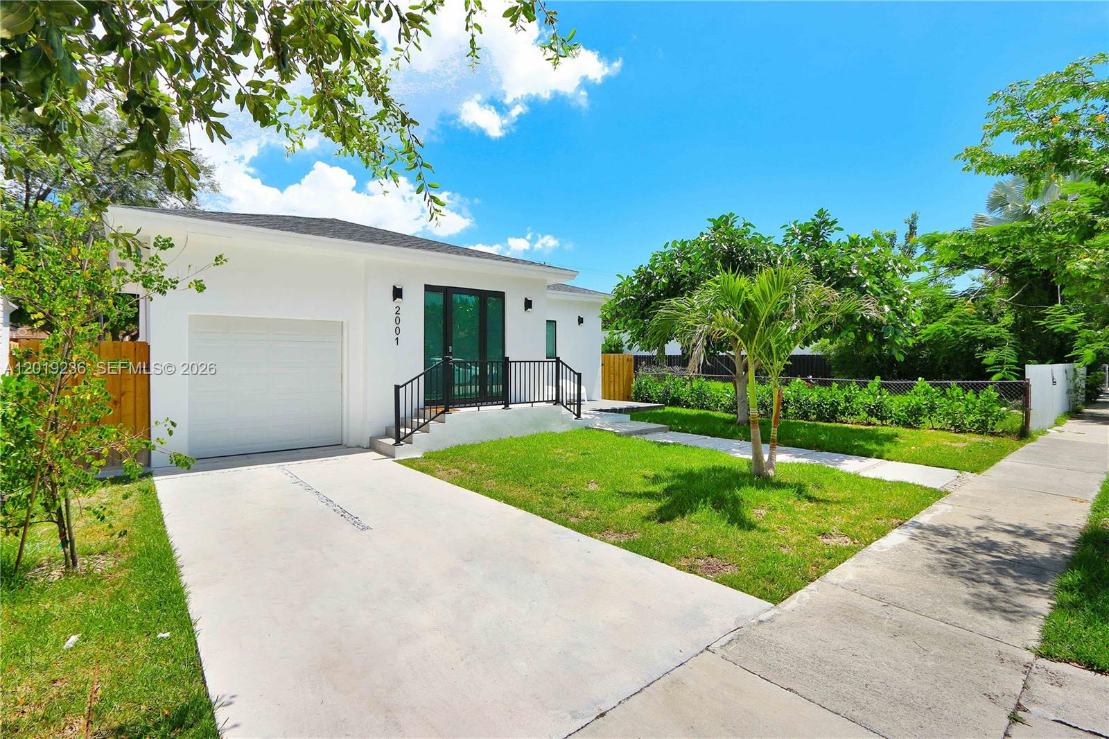 2001 Southwest 22nd Terrace Miami, FL 33145 - Photo 1 of 31 a front view of a house with garden