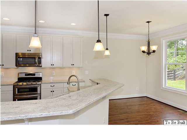 12 Timber Ridge Court Gordonsville, VA 22942 - Photo 11 of 31 a kitchen with granite countertop a sink a stove and a wooden floor