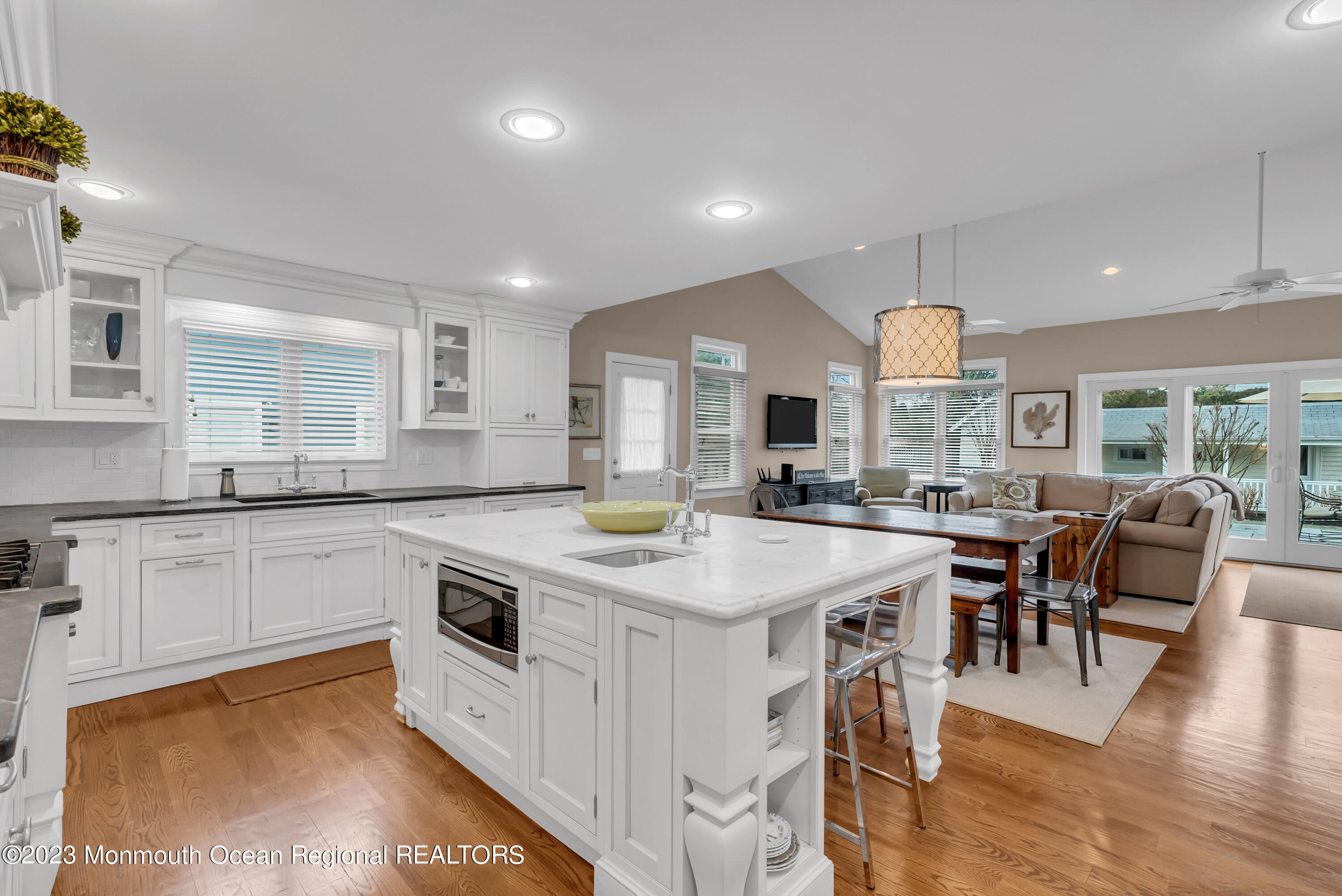 306 Worthington Avenue Spring Lake, NJ 07762 - Photo 14 of 52 a kitchen with stainless steel appliances granite countertop a stove and a refrigerator a sink with wooden floors