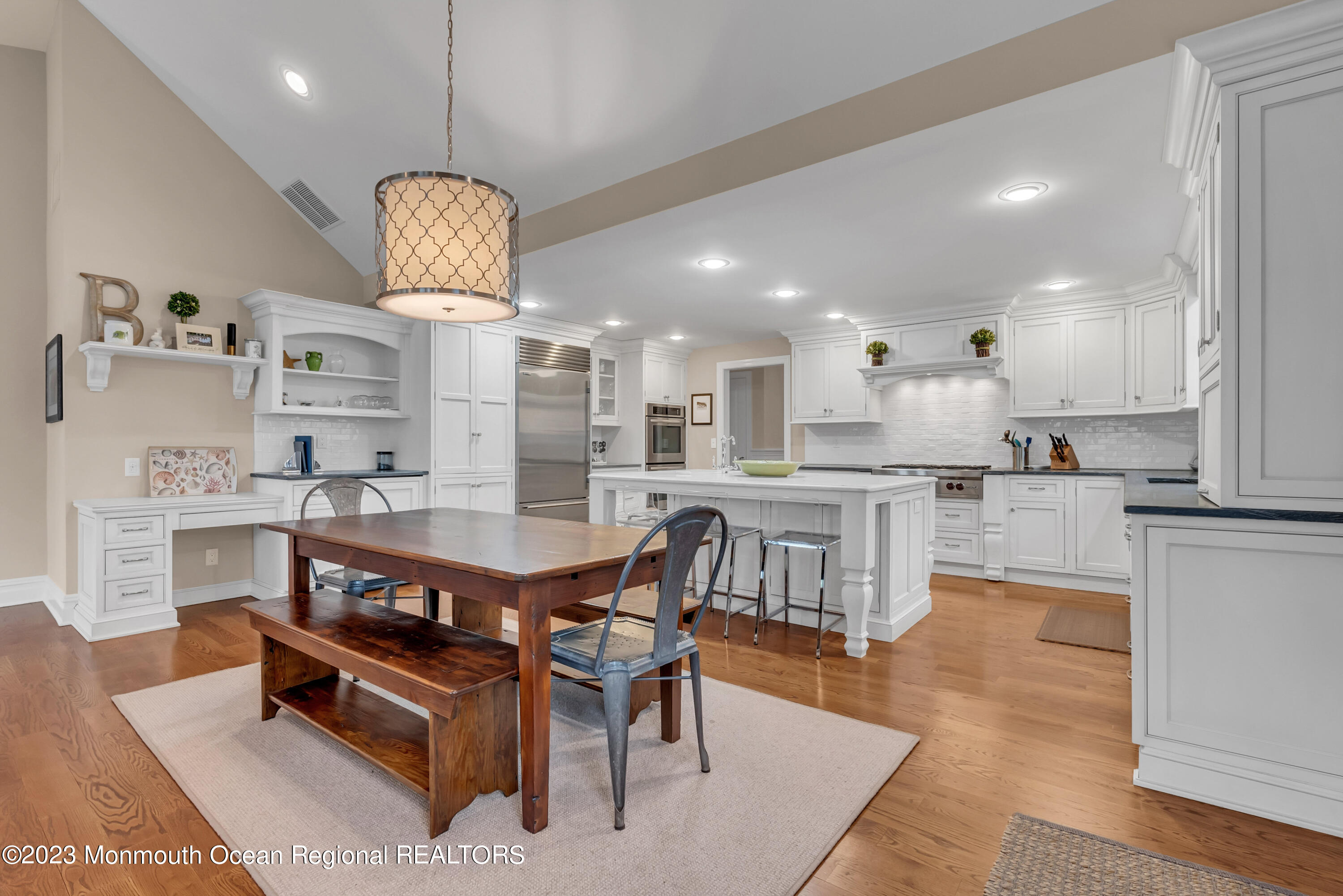 306 Worthington Avenue Spring Lake, NJ 07762 - Photo 19 of 52 a kitchen with kitchen island stainless steel appliances a dining table and chairs