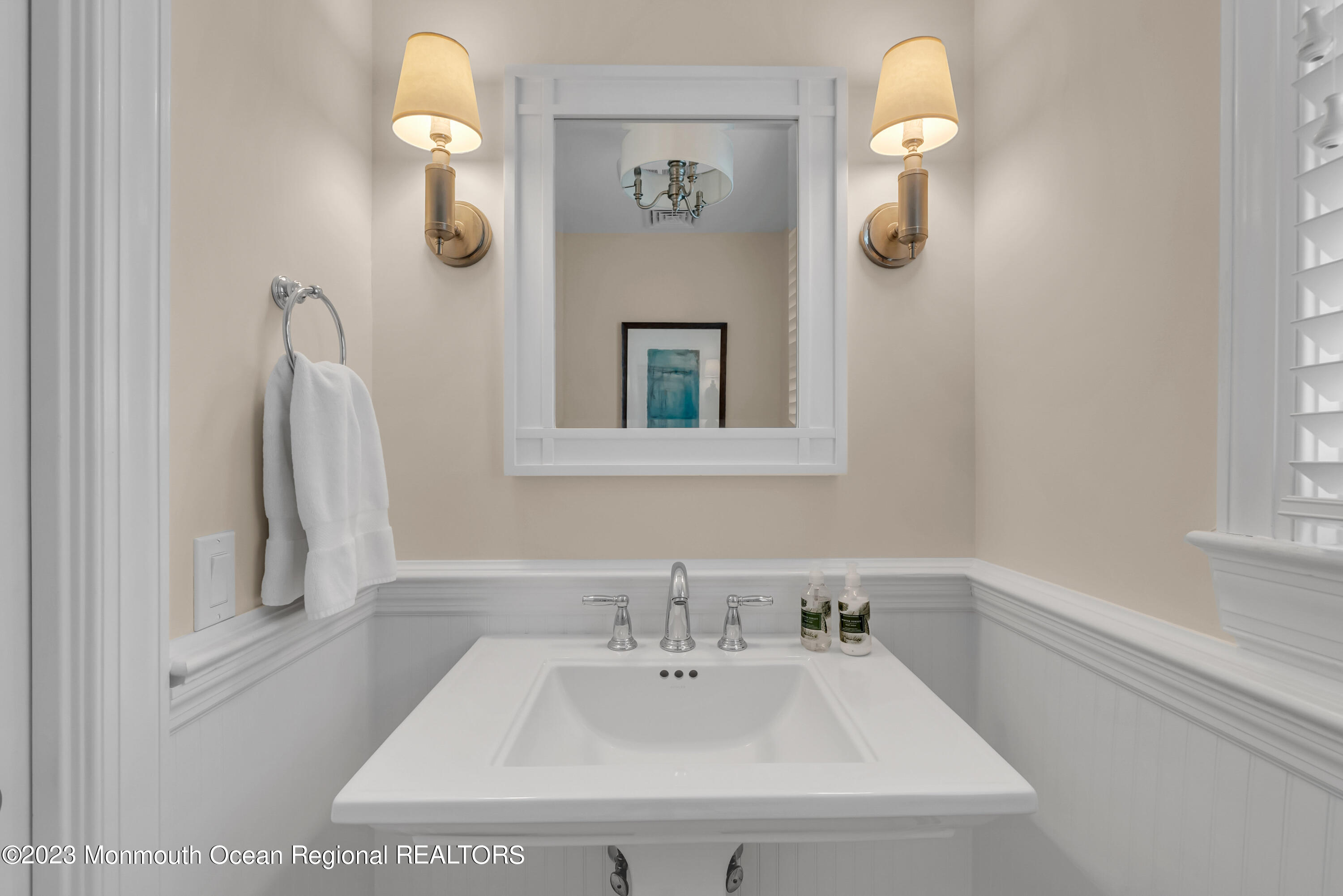 306 Worthington Avenue Spring Lake, NJ 07762 - Photo 22 of 52 a bathroom with a sink and a mirror