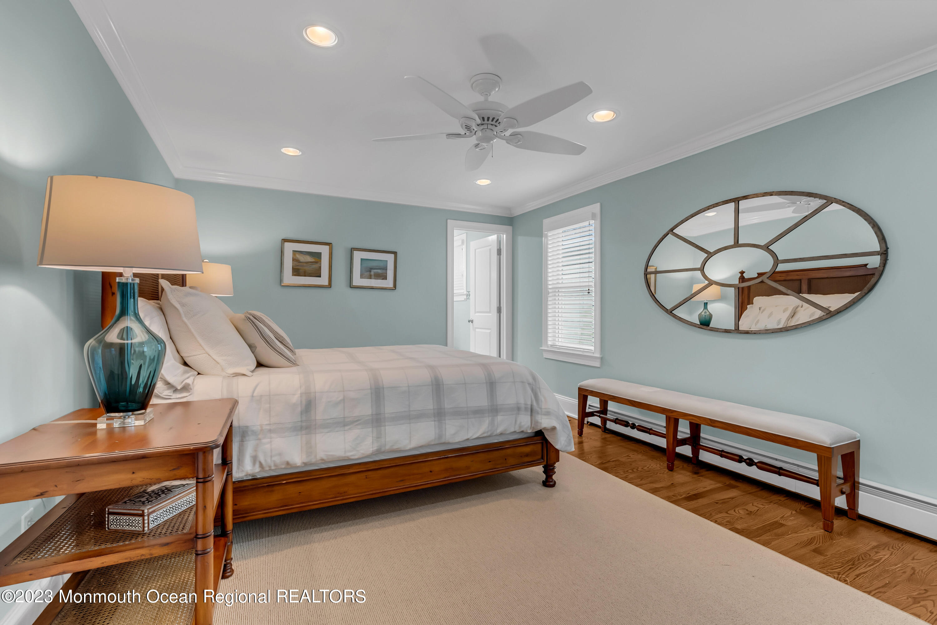 306 Worthington Avenue Spring Lake, NJ 07762 - Photo 23 of 52 a bedroom with a bed a dresser and paintings on the wall