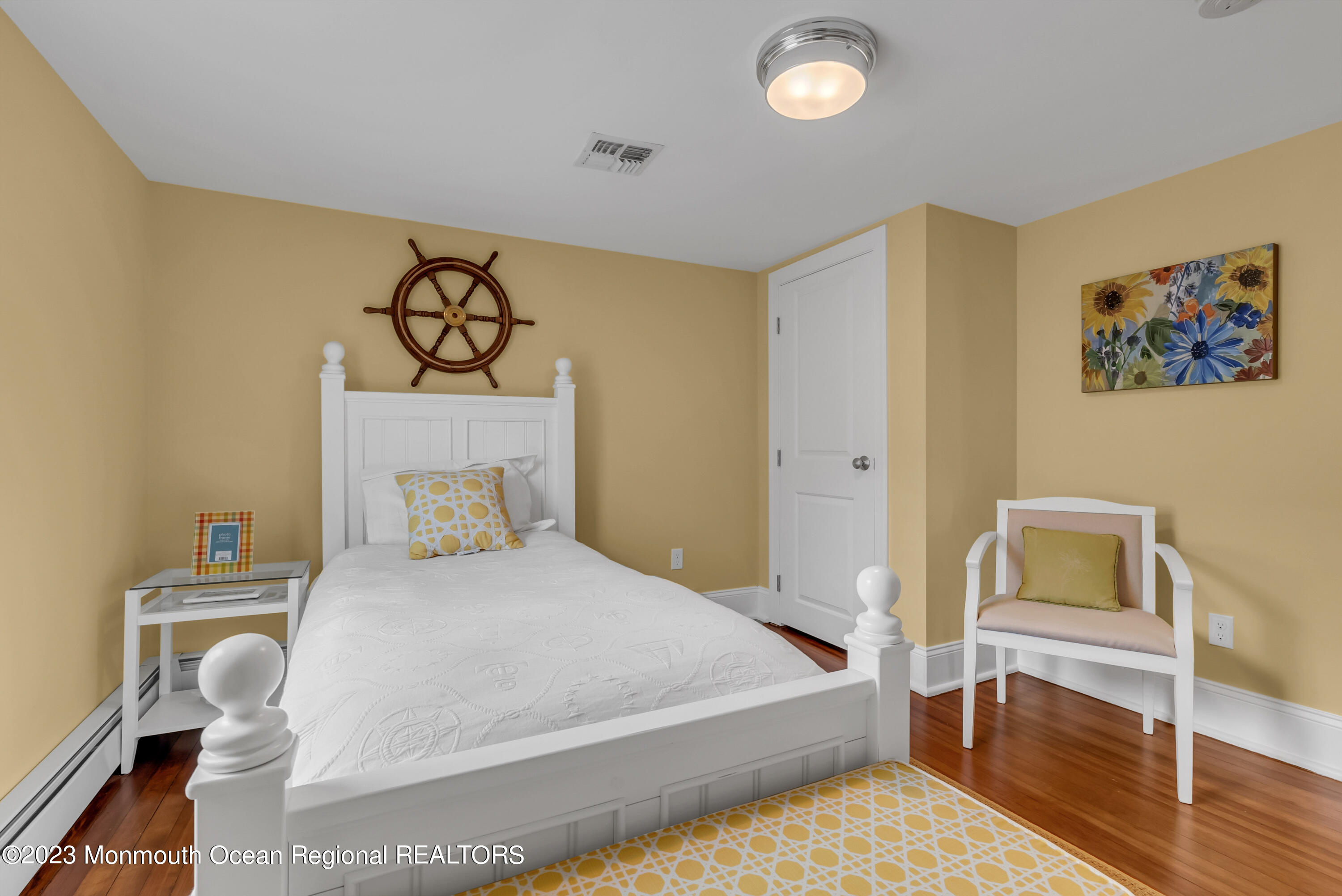 306 Worthington Avenue Spring Lake, NJ 07762 - Photo 30 of 52 a bedroom with a bed and a table in it