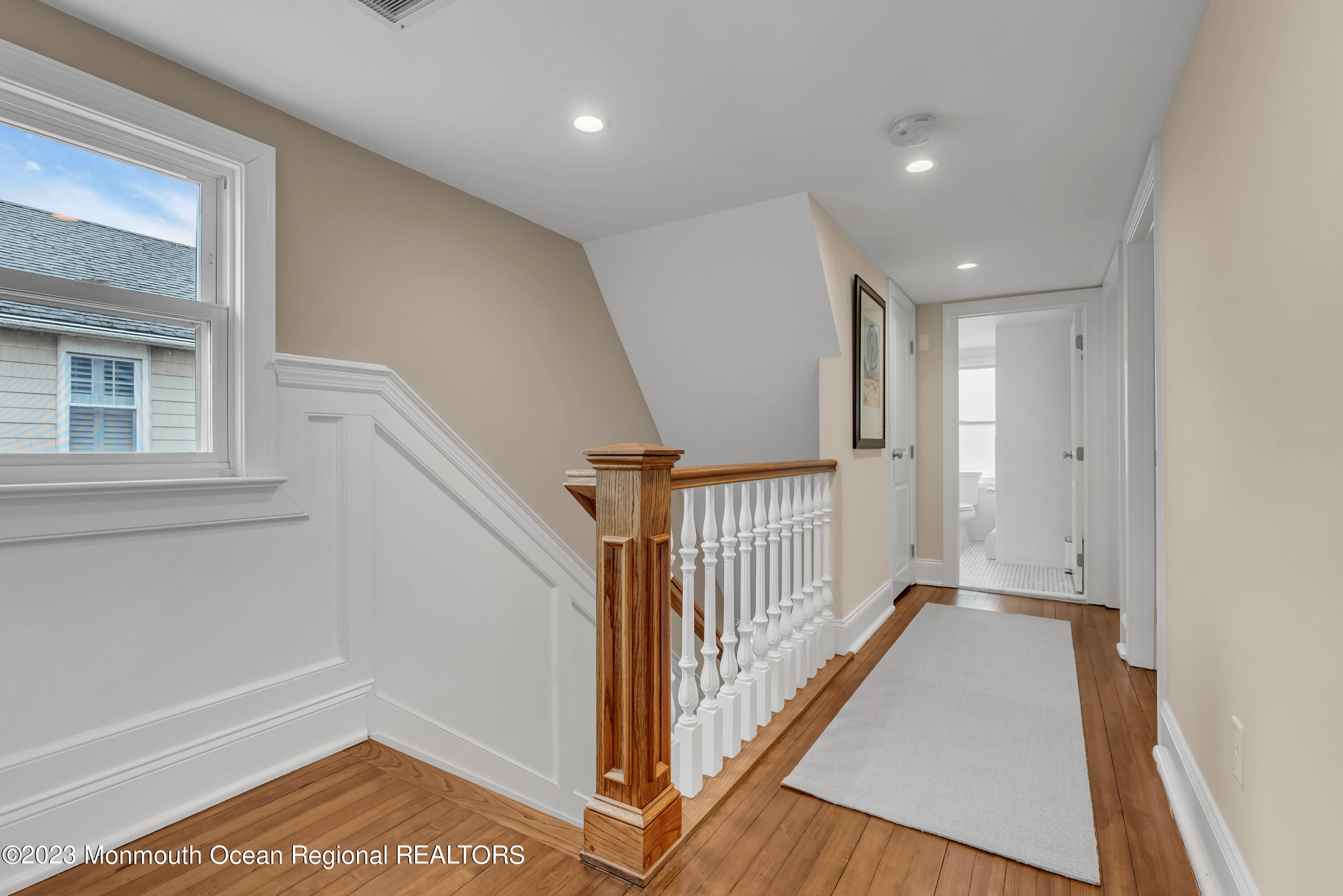 306 Worthington Avenue Spring Lake, NJ 07762 - Photo 34 of 52 a view of a hallway with a white walls and wooden floor