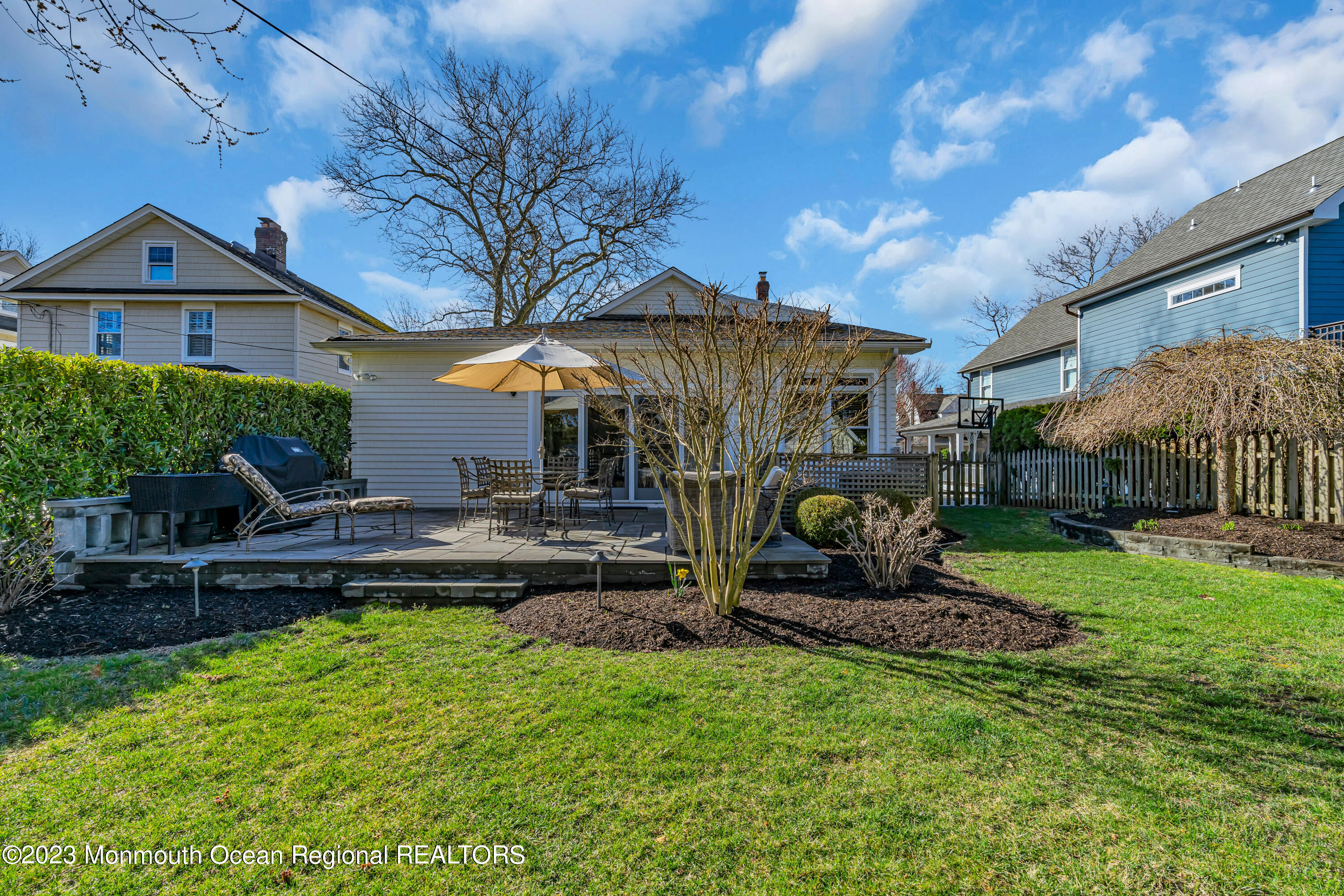 306 Worthington Avenue Spring Lake, NJ 07762 - Photo 45 of 52 a front view of a house with a garden and sitting area