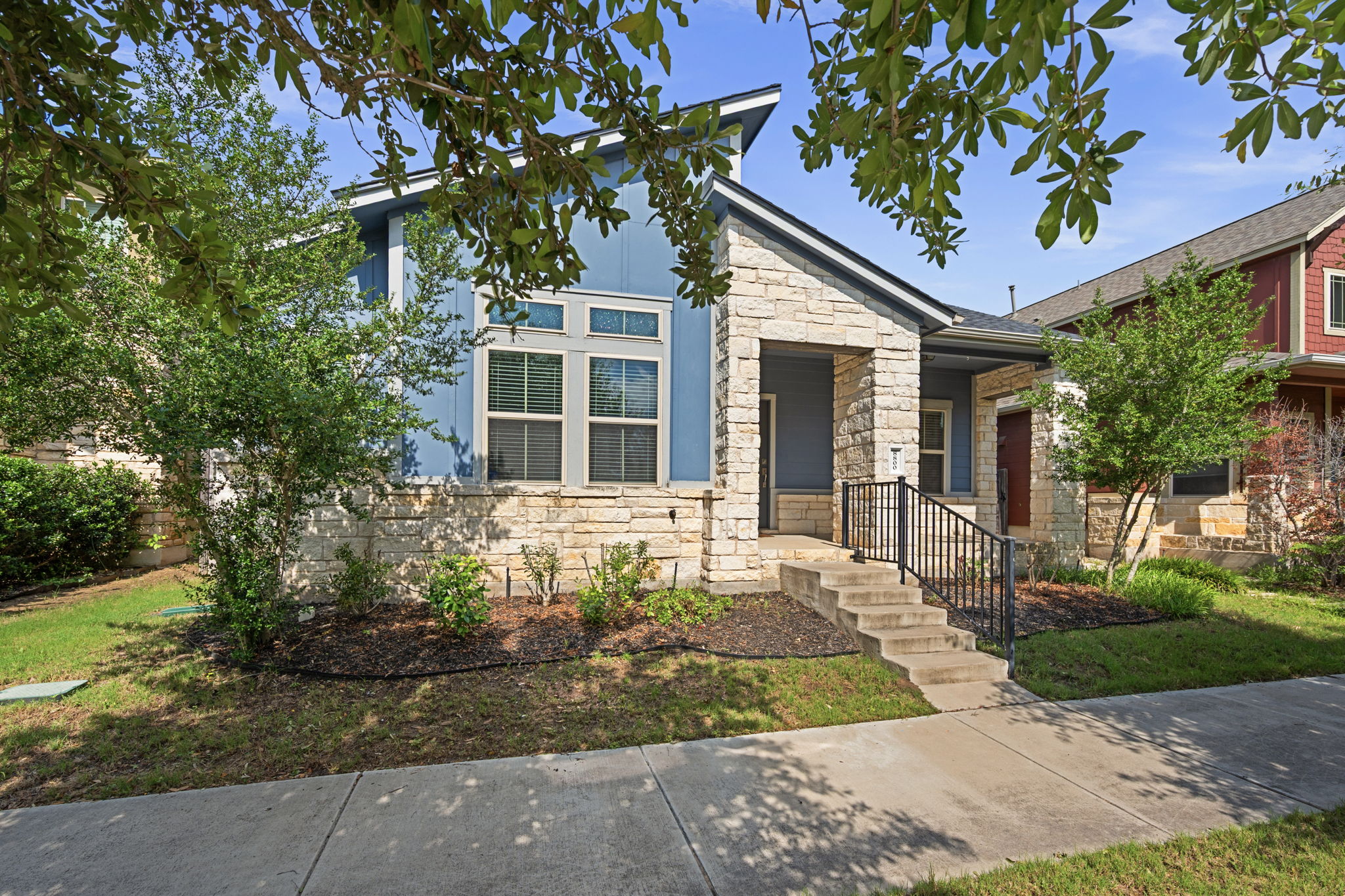 8800 Slater Drive Austin, TX 78747 - Photo 38 of 40 a front view of a house with garden