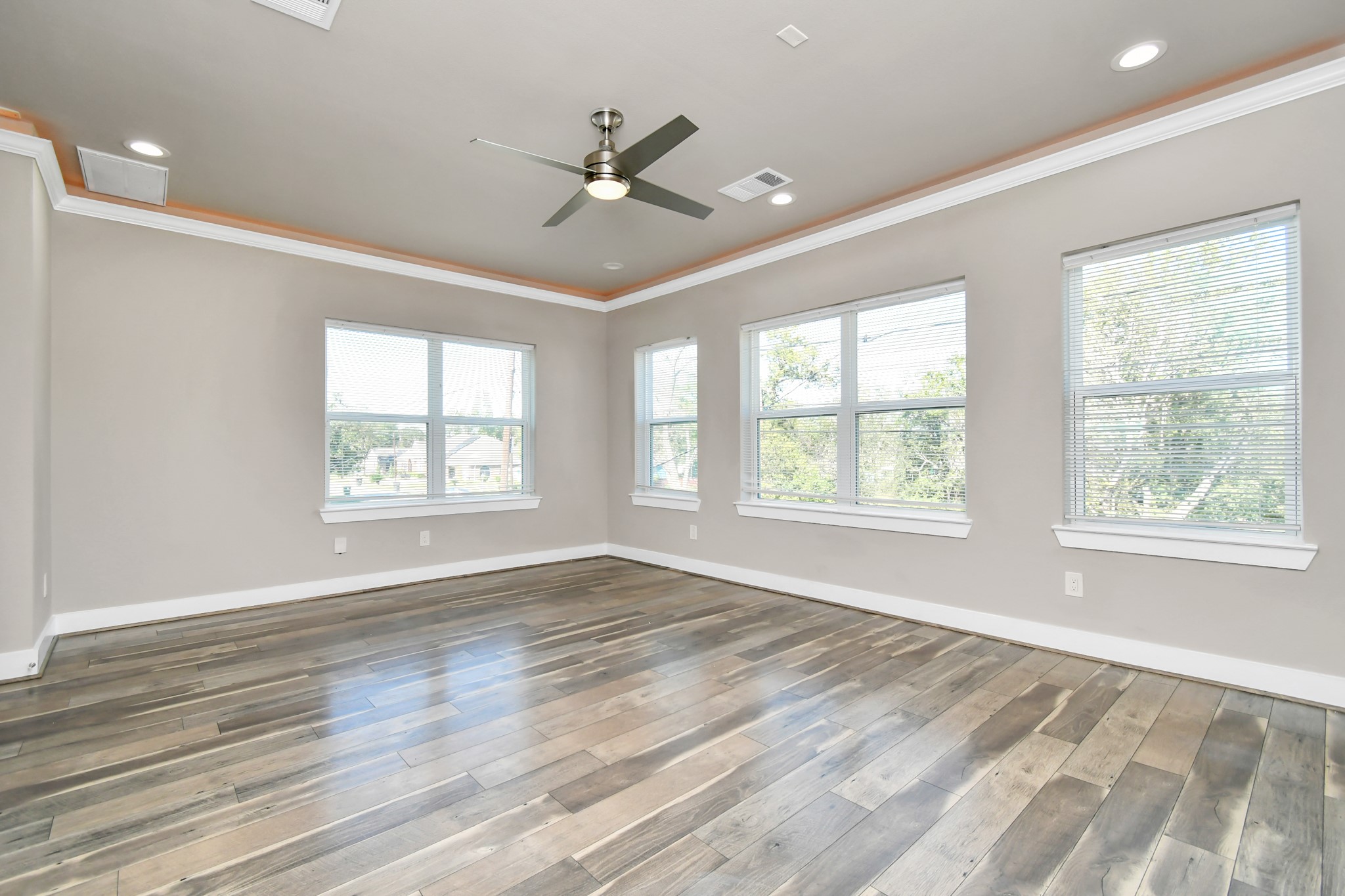 3538 Noah Street Houston, TX 77021 - Photo 12 of 33 a view of an empty room with a window and wooden floor