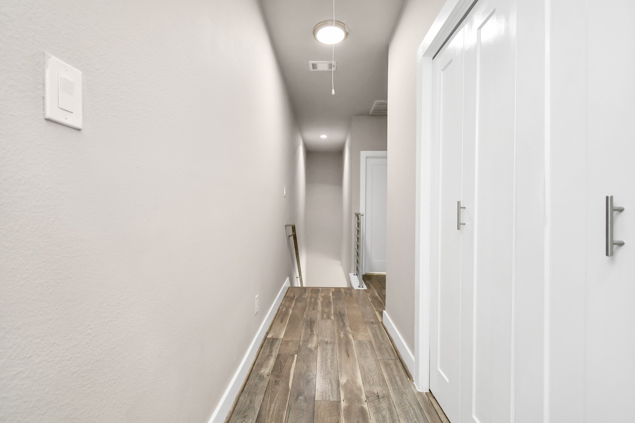 3538 Noah Street Houston, TX 77021 - Photo 17 of 33 a view of a hallway with wooden floor