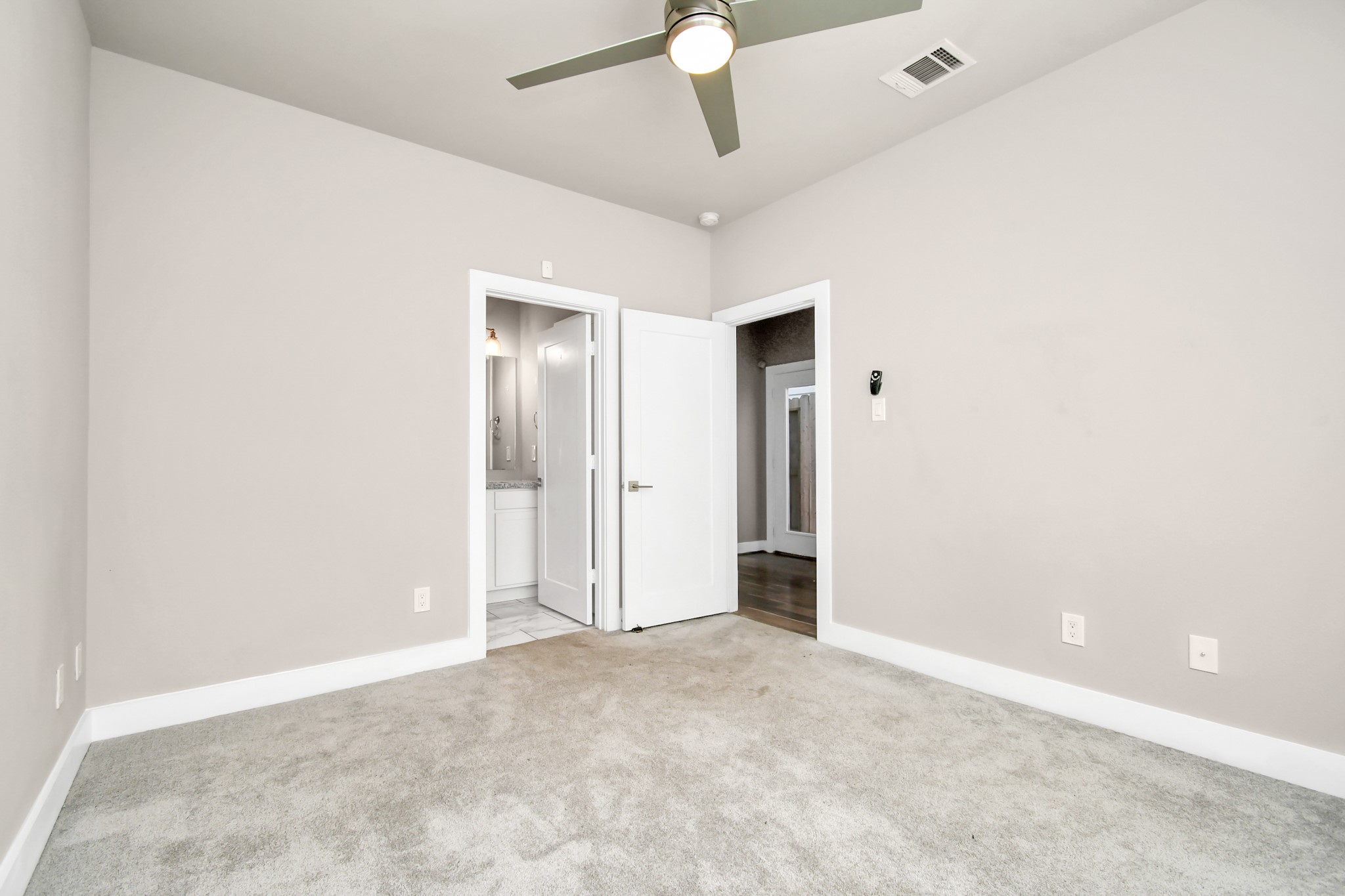 3538 Noah Street Houston, TX 77021 - Photo 4 of 33 an empty room with a ceiling fan and carpet