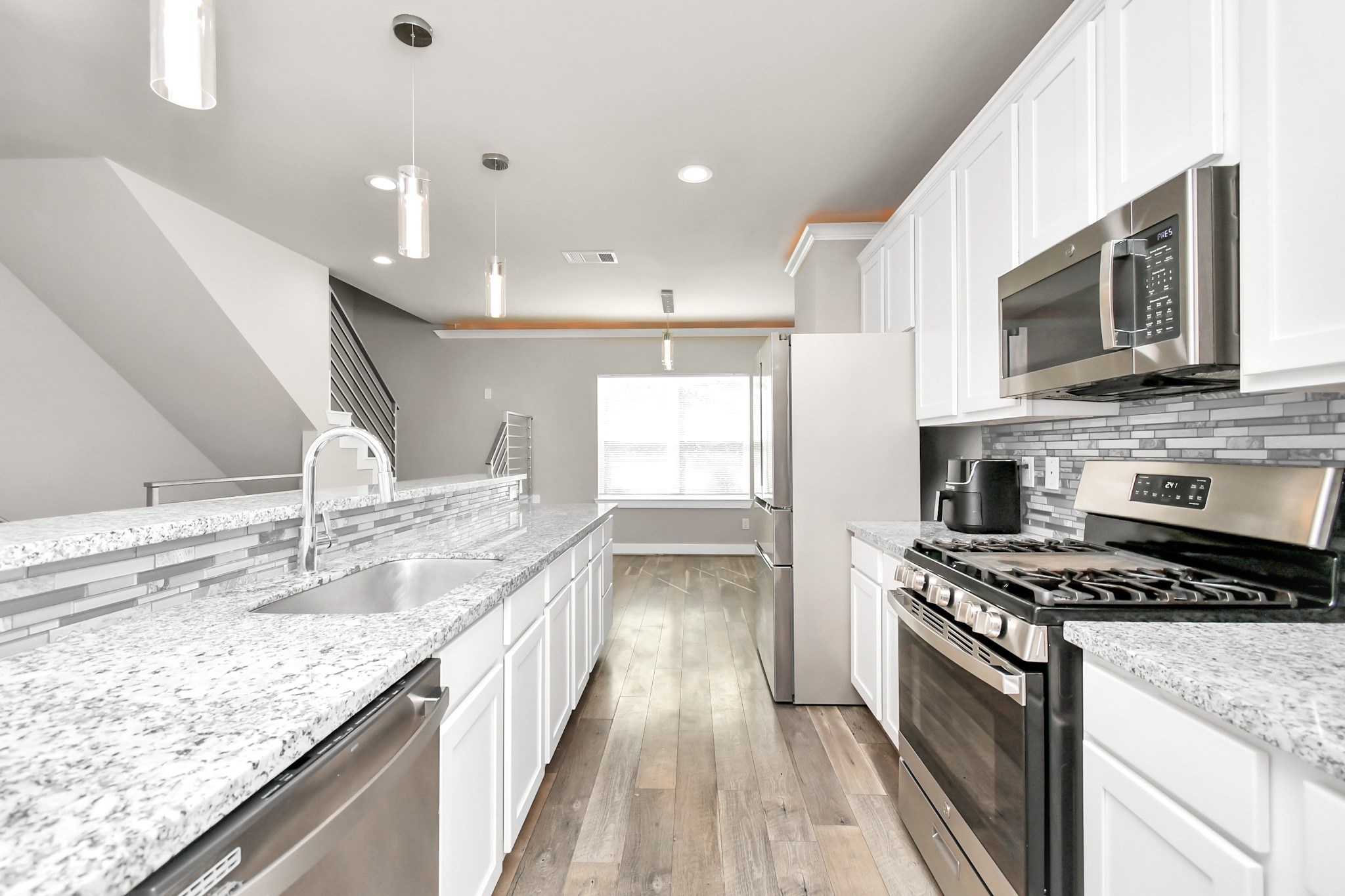 3538 Noah Street Houston, TX 77021 - Photo 9 of 33 a kitchen with stainless steel appliances granite countertop a stove and a sink