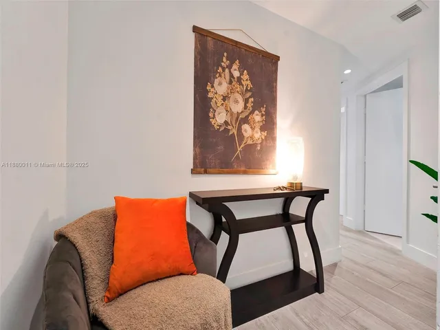 a view of a chairs and table in the balcony