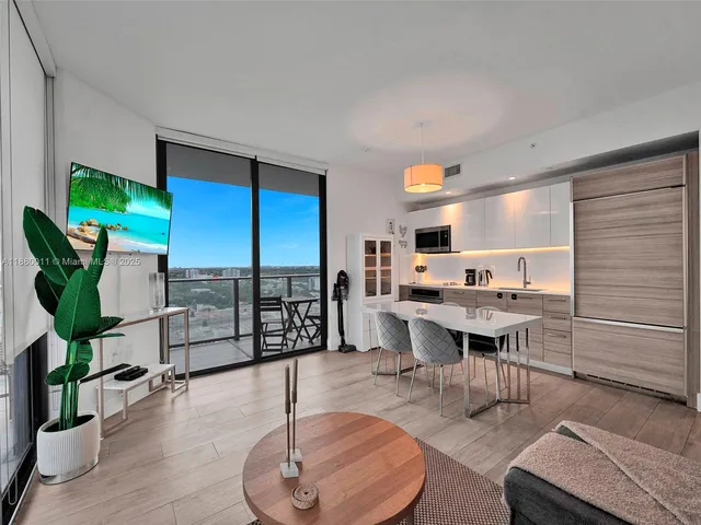 a view of a living room and dining room
