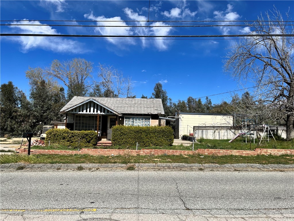 35432 County Line Road Yucaipa, CA 92399 - Photo 1 of 1 a front view of a house with a yard
