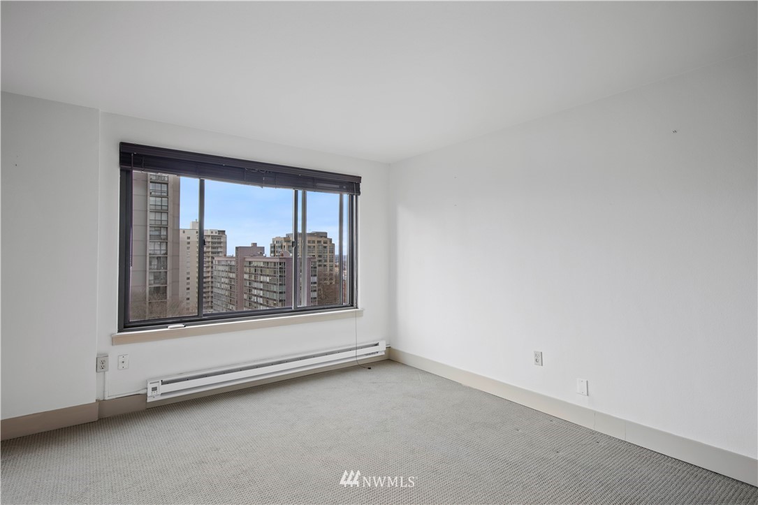 1105 Spring Street, Unit 1006 Seattle, WA 98104 - Photo 12 of 22 an empty room with a window