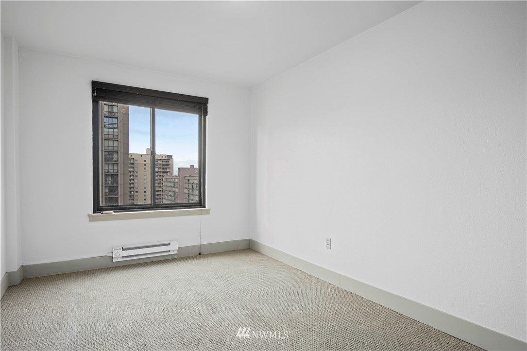 1105 Spring Street, Unit 1006 Seattle, WA 98104 - Photo 14 of 22 an empty room with a window