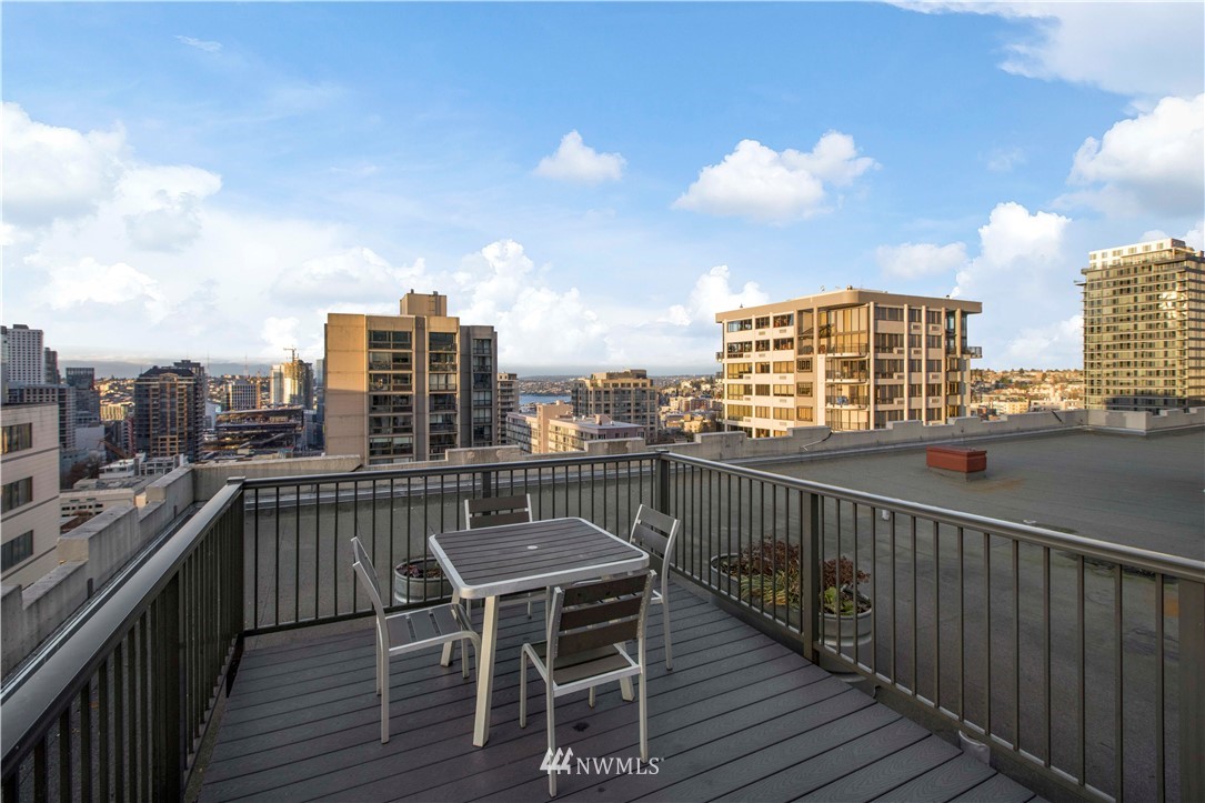 1105 Spring Street, Unit 1006 Seattle, WA 98104 - Photo 21 of 22 a view of a balcony with wooden floor