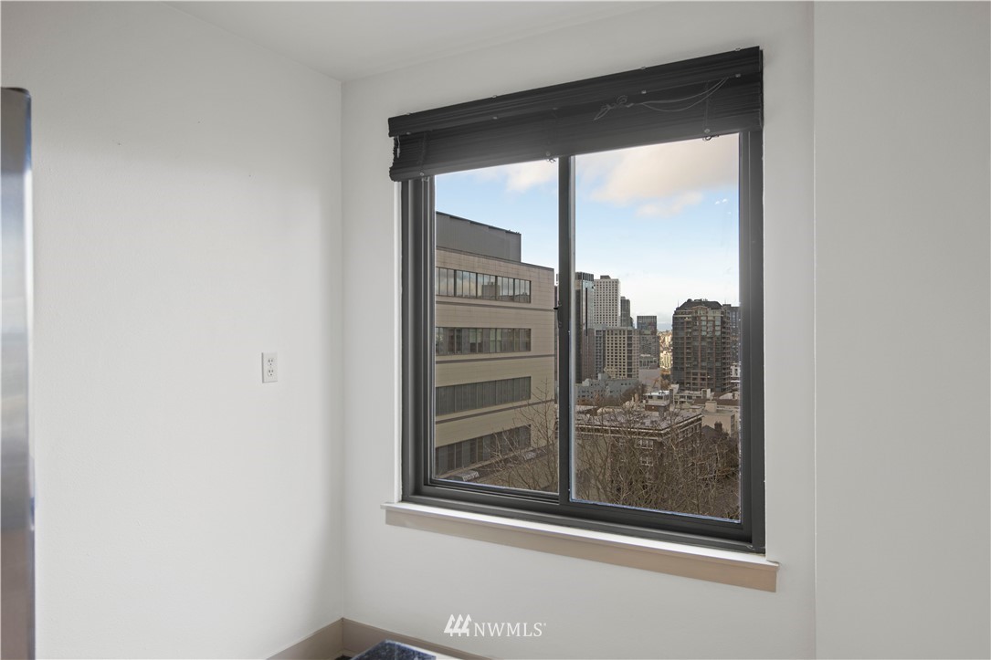 1105 Spring Street, Unit 1006 Seattle, WA 98104 - Photo 10 of 22 a view of a glass door with a glass window