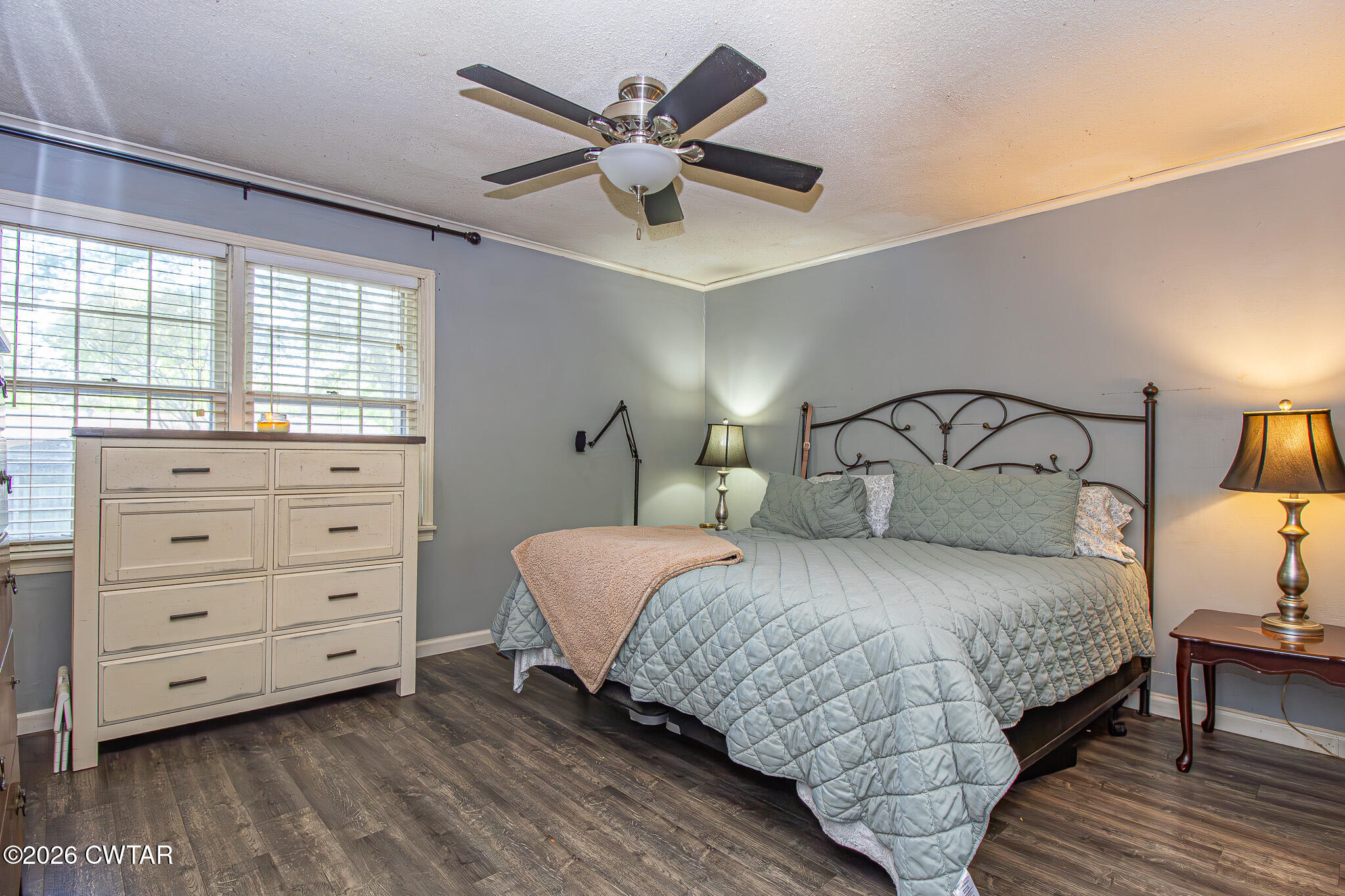 3075 Arnold Street Milan, TN 38358 - Photo 11 of 24 a bedroom with a bed and a ceiling fan