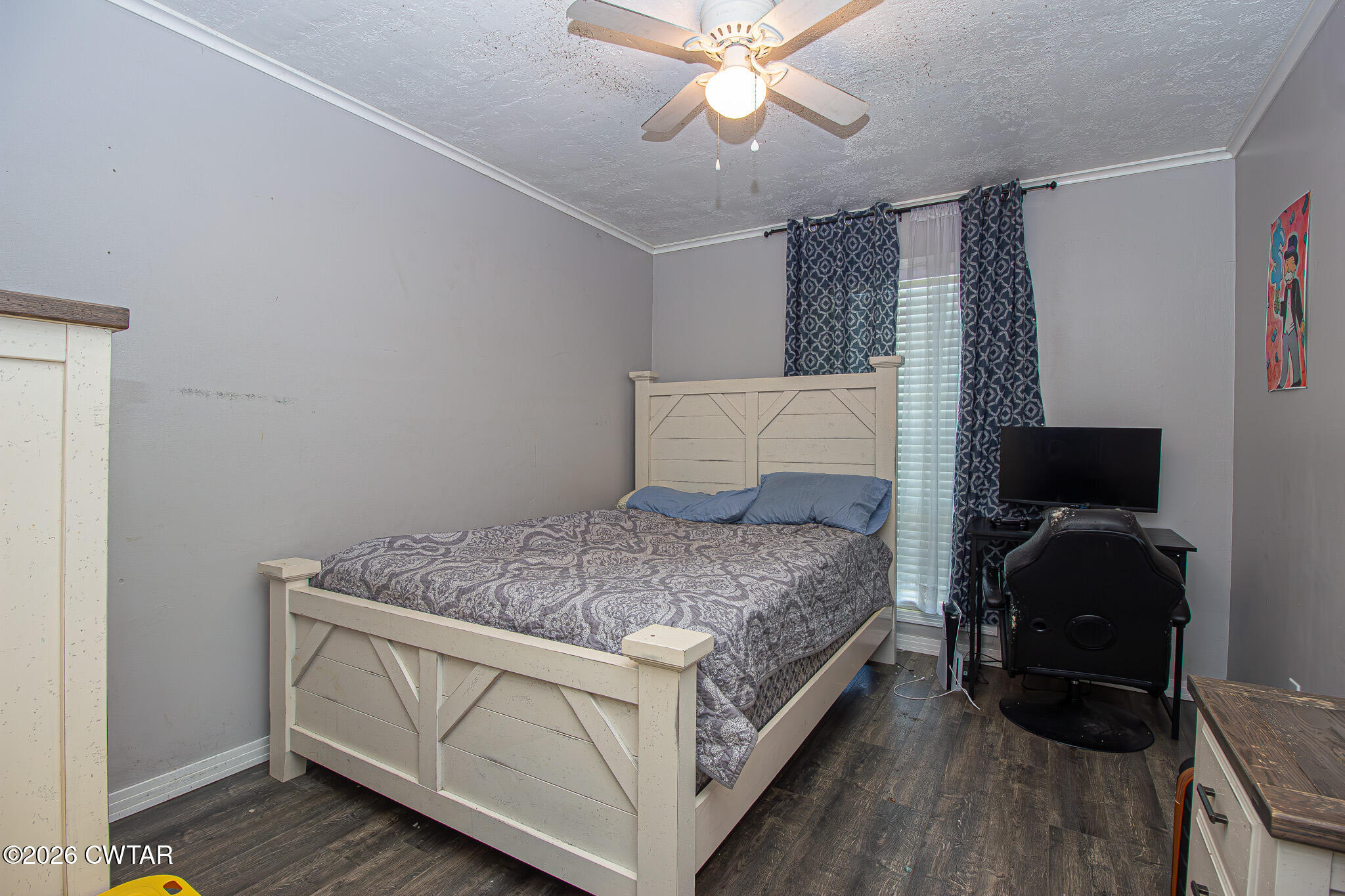 3075 Arnold Street Milan, TN 38358 - Photo 15 of 24 a bedroom with a bed and wooden floor