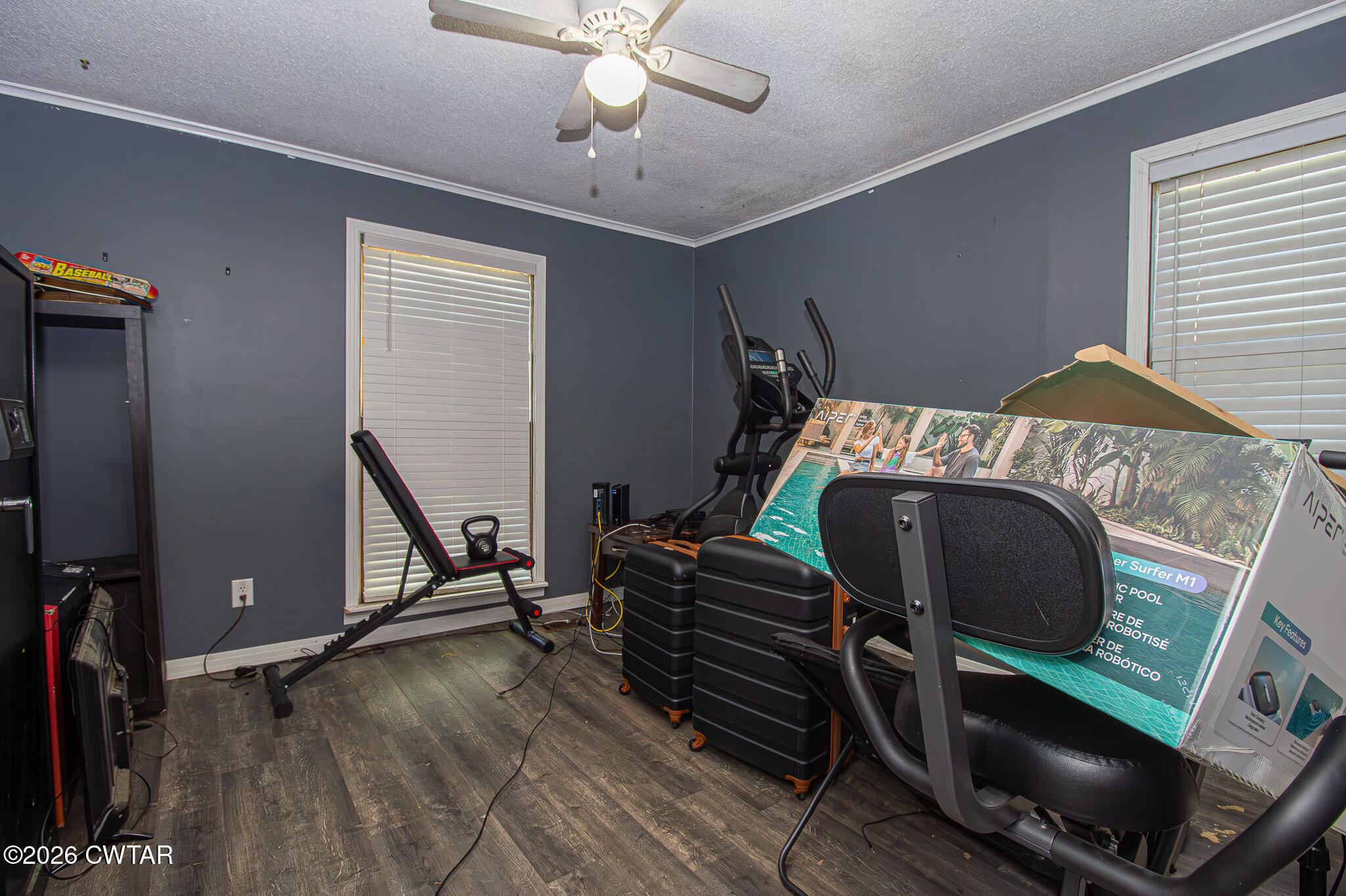 3075 Arnold Street Milan, TN 38358 - Photo 16 of 24 a bedroom with a bed and a chandelier