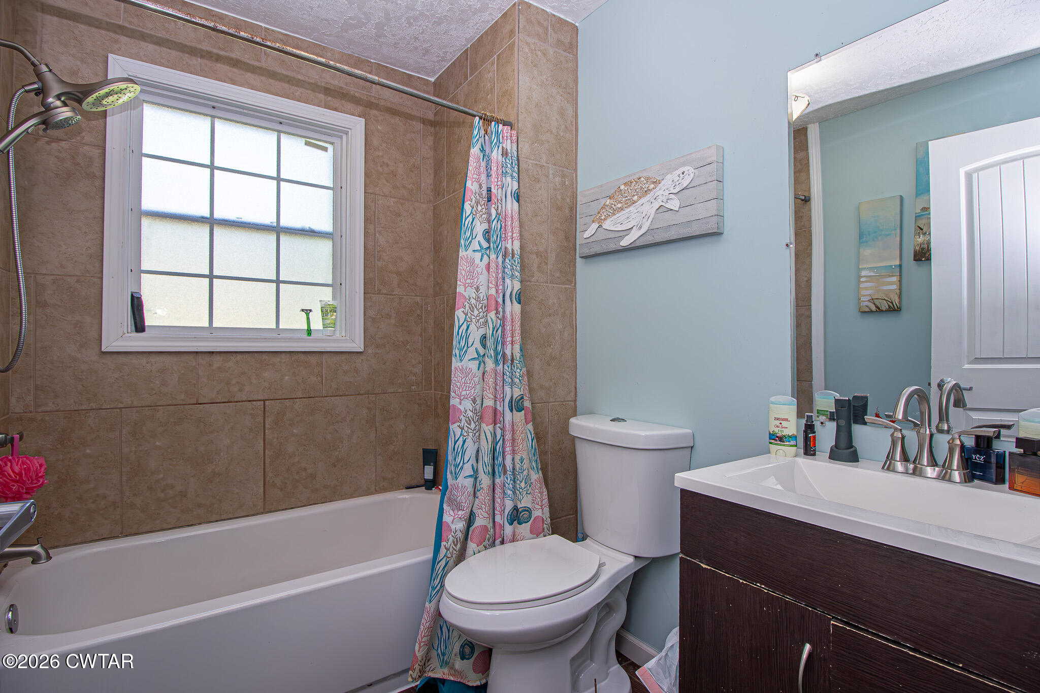 3075 Arnold Street Milan, TN 38358 - Photo 17 of 24 a bathroom with a sink toilet and bathtub
