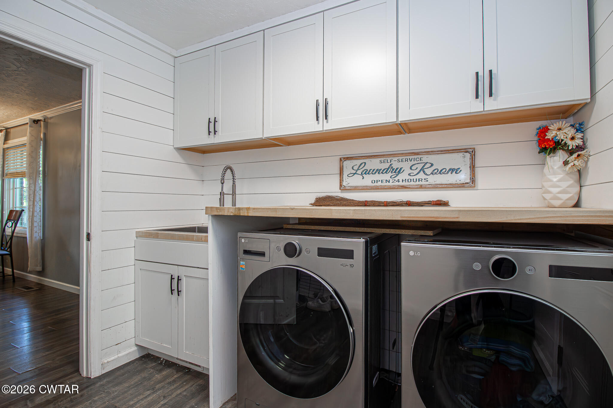 3075 Arnold Street Milan, TN 38358 - Photo 19 of 24 a view of cabinets with washer and dryer