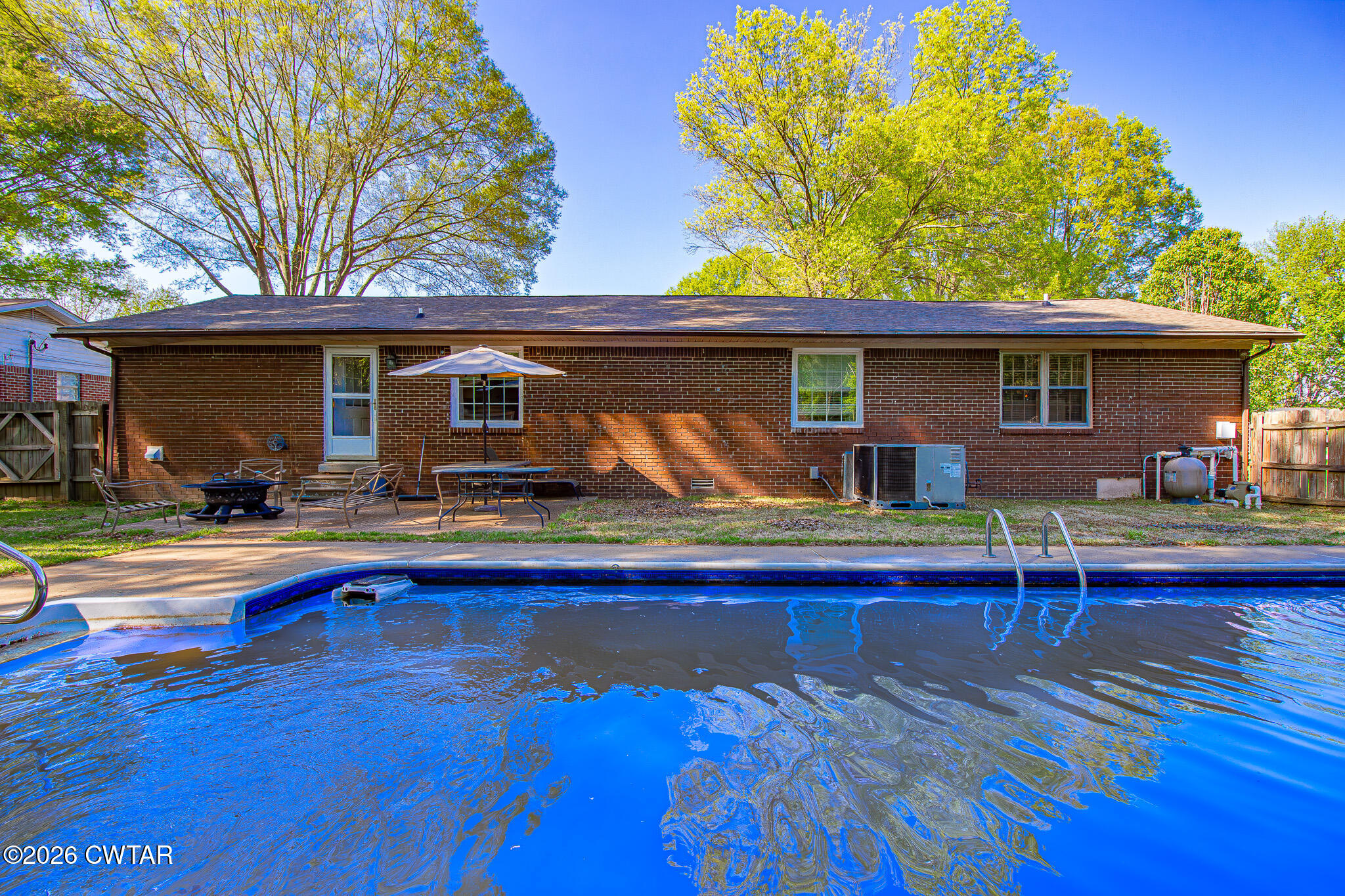 3075 Arnold Street Milan, TN 38358 - Photo 20 of 24 a view of pool with outdoor seating