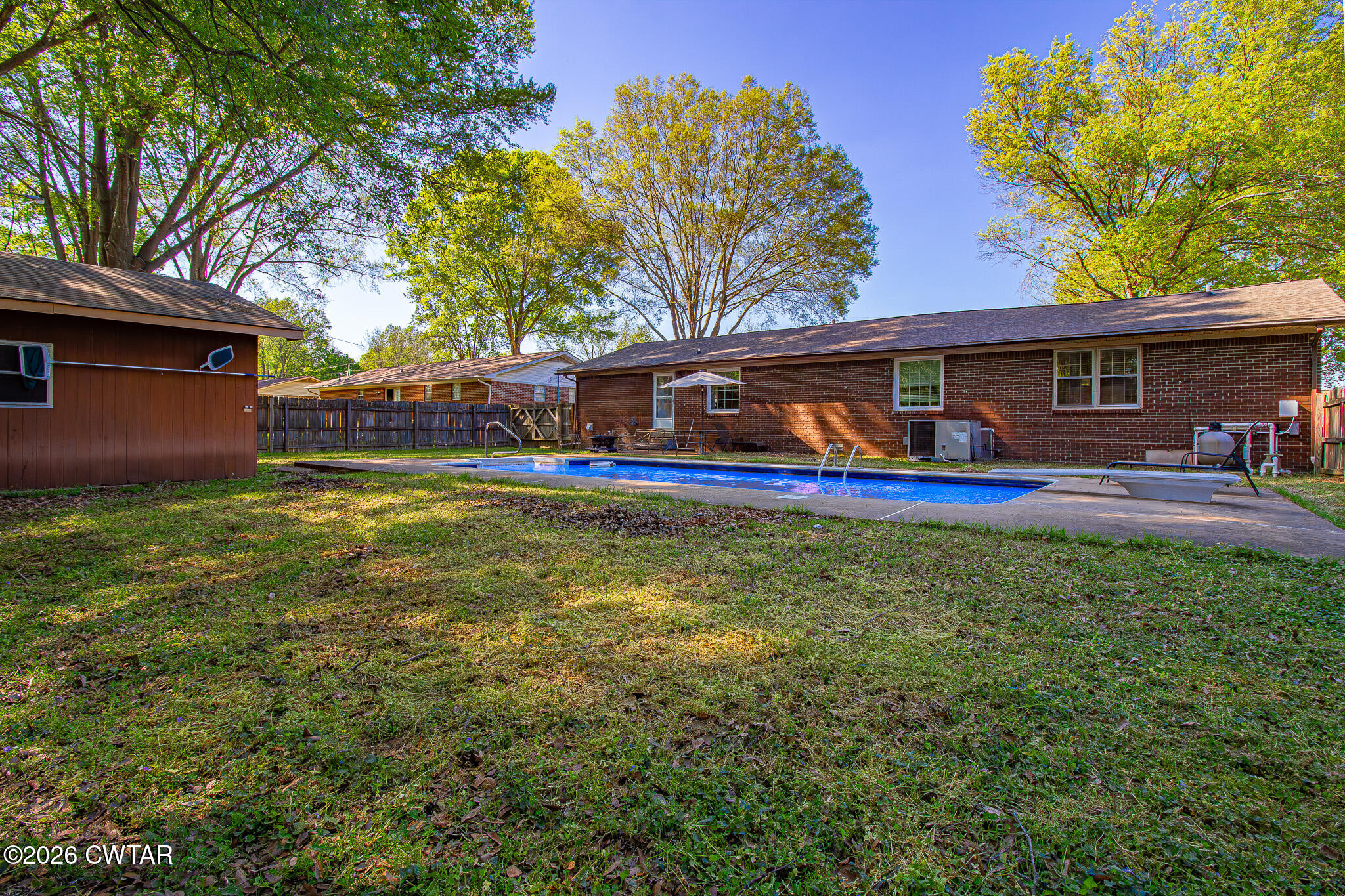 3075 Arnold Street Milan, TN 38358 - Photo 22 of 24 a view of a house with a yard porch and sitting area
