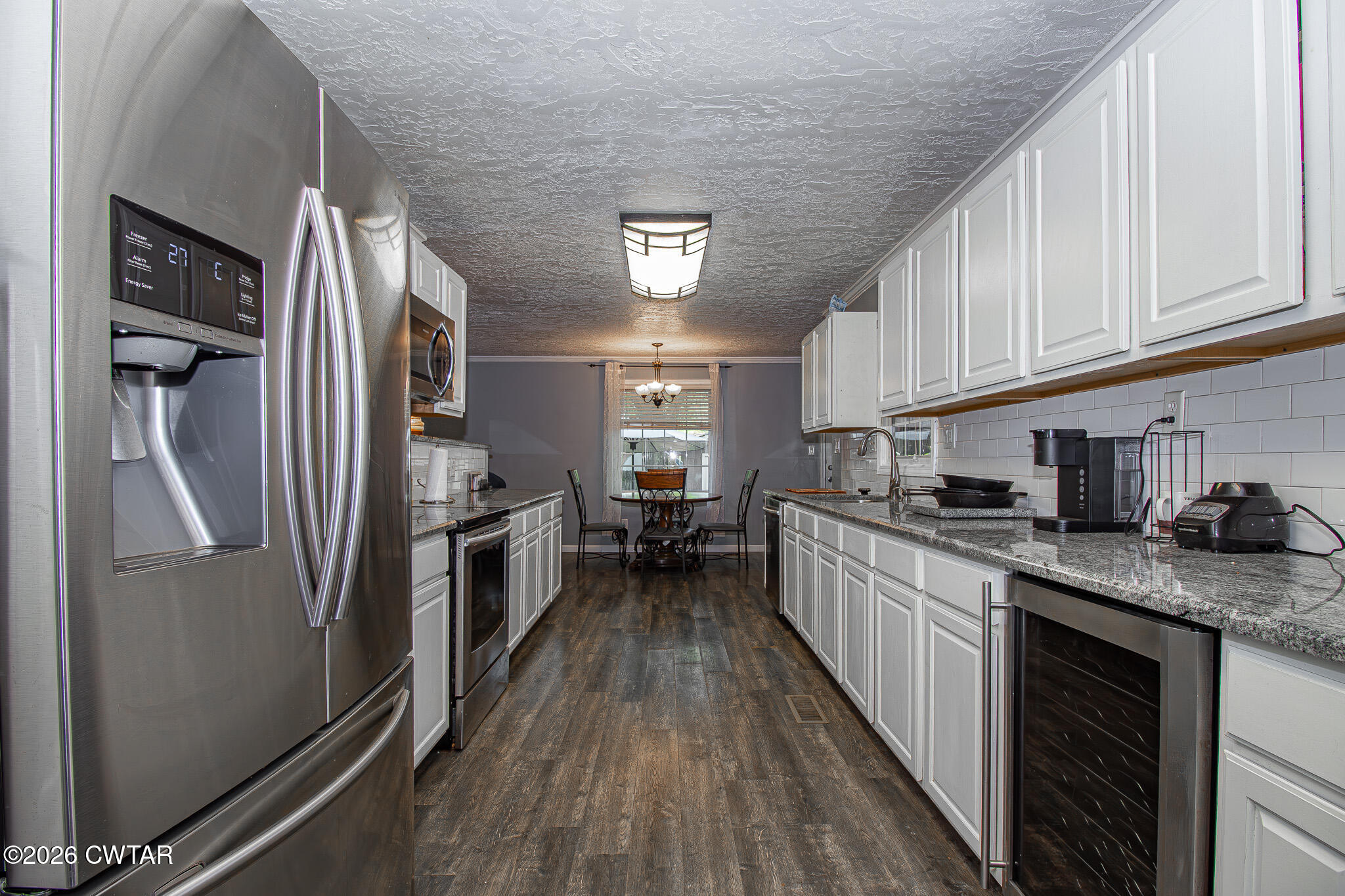 3075 Arnold Street Milan, TN 38358 - Photo 6 of 24 a kitchen with stainless steel appliances granite countertop lots of counter top space