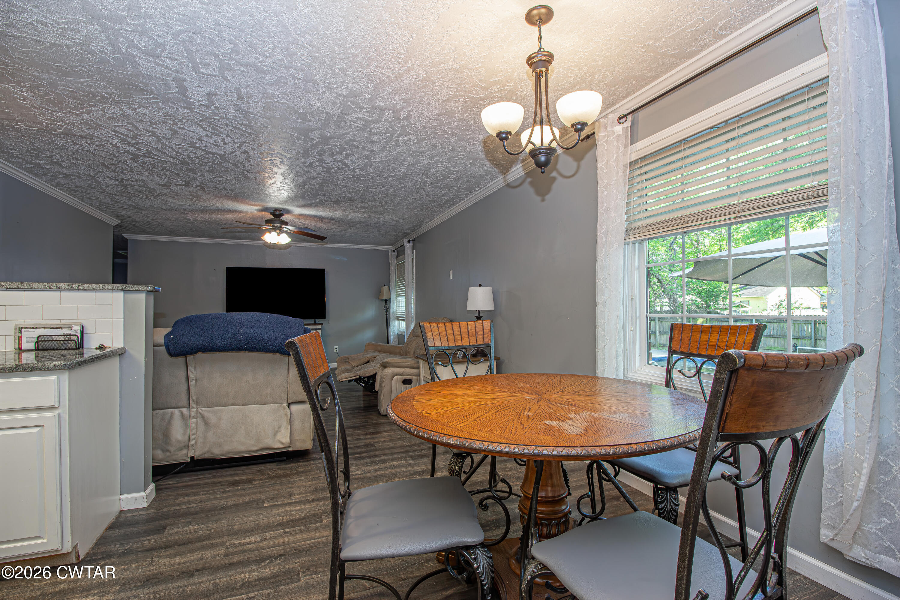 3075 Arnold Street Milan, TN 38358 - Photo 8 of 24 a view of a dining room with furniture window and outside view