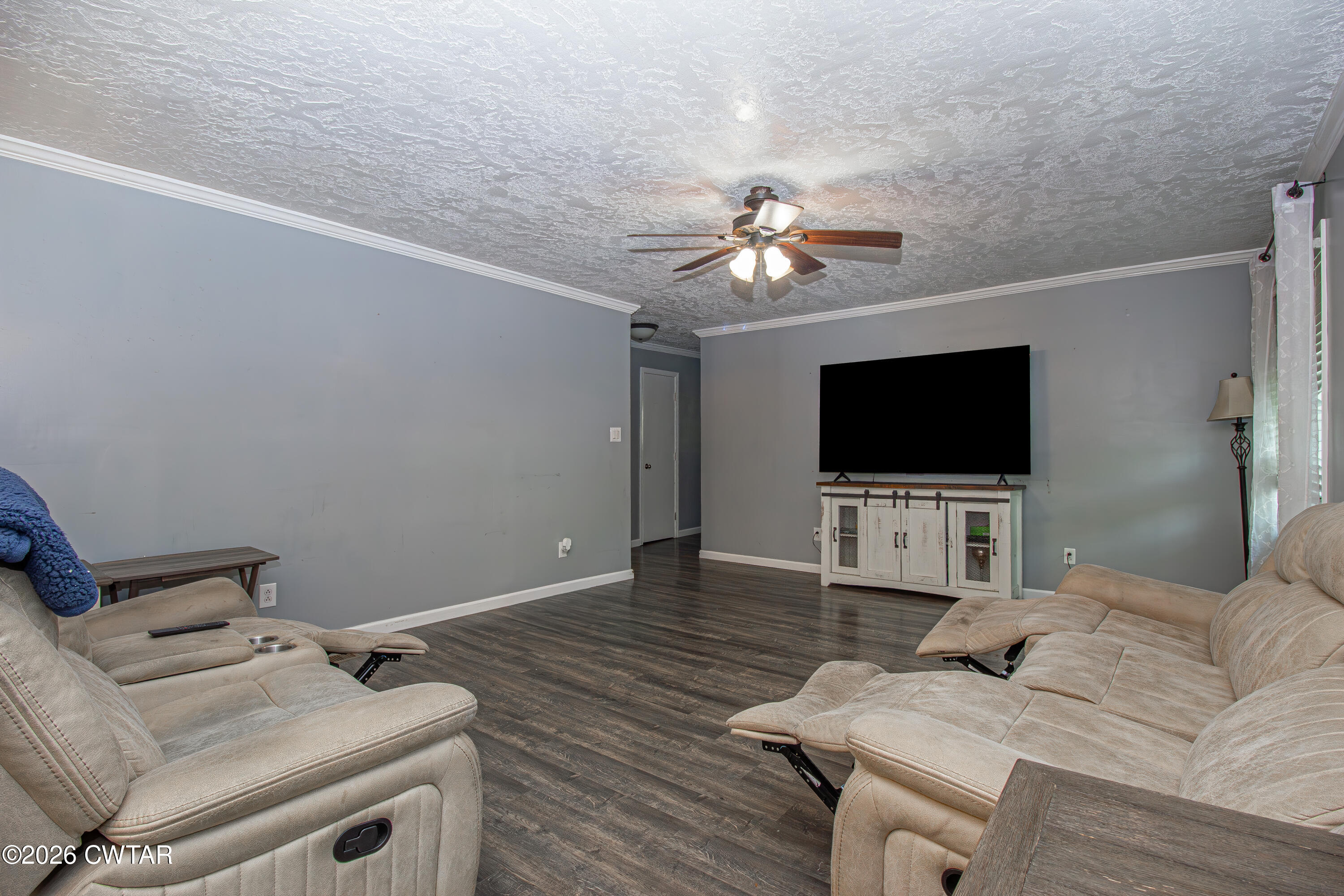 3075 Arnold Street Milan, TN 38358 - Photo 9 of 24 a living room with furniture and a flat screen tv