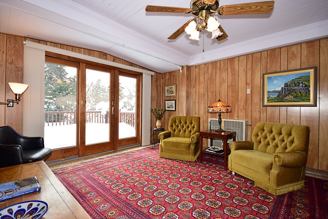 489 Uvedale Road Riverside, IL 60546 - Photo 12 of 25 a living room with furniture and a rug
