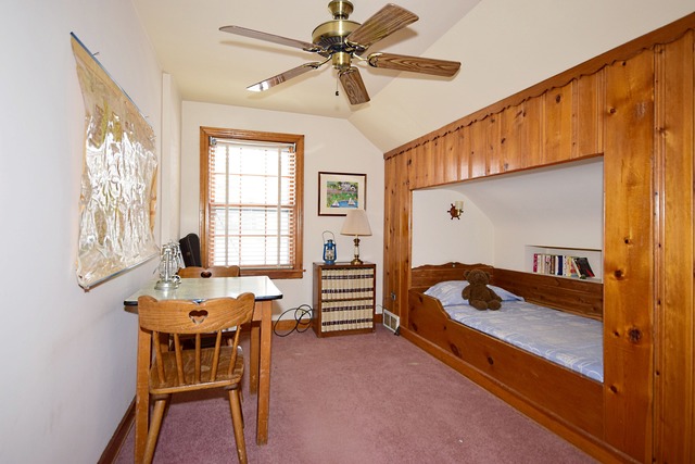 489 Uvedale Road Riverside, IL 60546 - Photo 16 of 25 a bedroom with furniture and a window