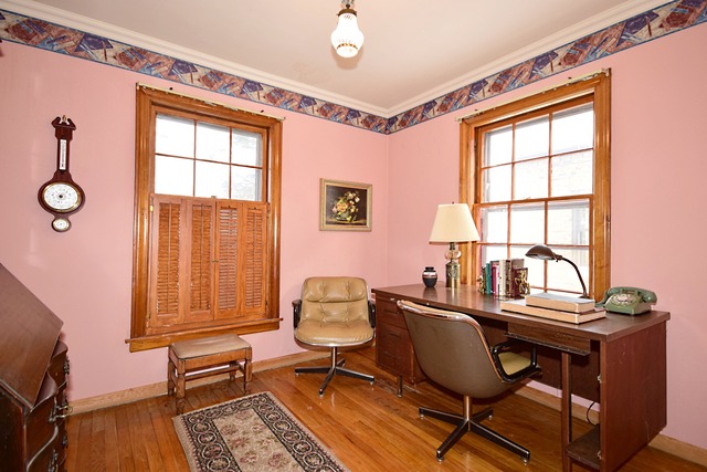 489 Uvedale Road Riverside, IL 60546 - Photo 17 of 25 a view of a workspace with furniture and a window