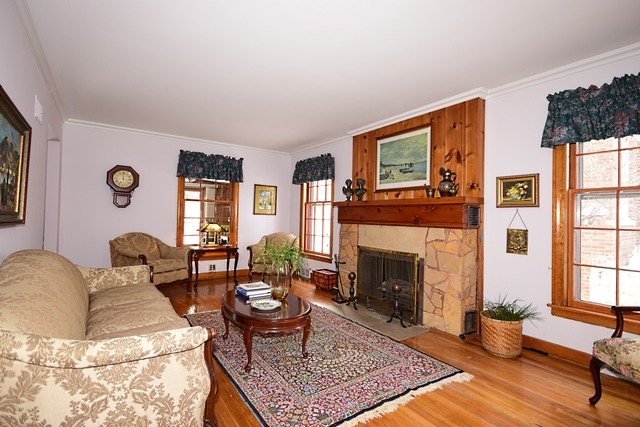489 Uvedale Road Riverside, IL 60546 - Photo 2 of 25 a living room with furniture a fireplace and window