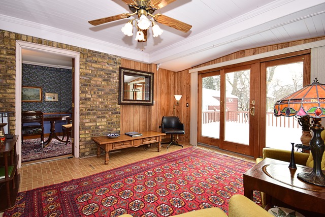 489 Uvedale Road Riverside, IL 60546 - Photo 9 of 25 a living room with furniture and a large window