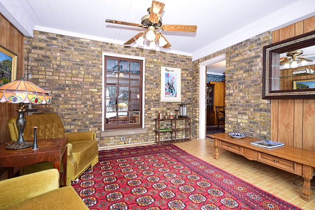 489 Uvedale Road Riverside, IL 60546 - Photo 10 of 25 a bedroom with furniture and a fireplace