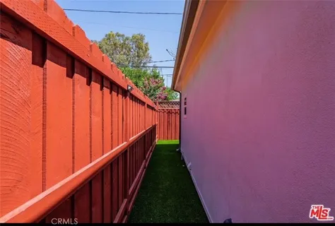 a view of a backyard with a tub and chair
