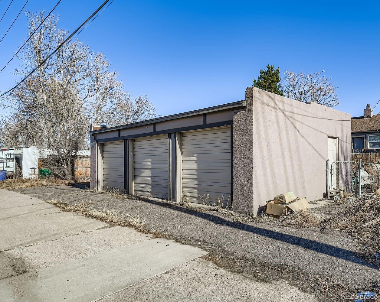3525 St Paul Street Denver, CO 80205 - Photo 11 of 11 a view of a house with a yard