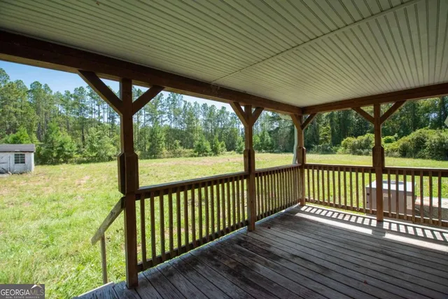 a porch with wooden floor in outdoor space