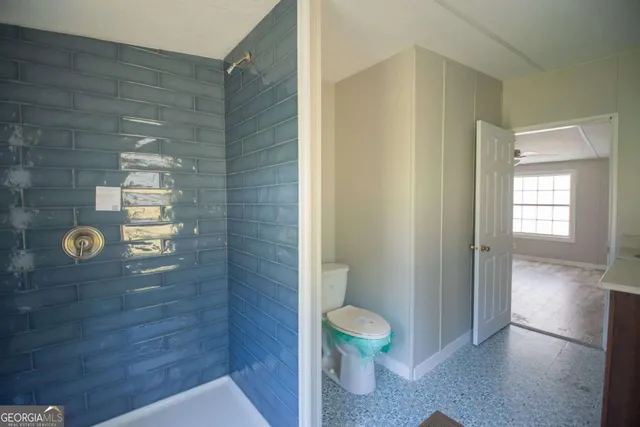 a view of bathroom with a toilet