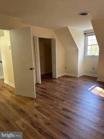 a view of living room kitchen and dining room