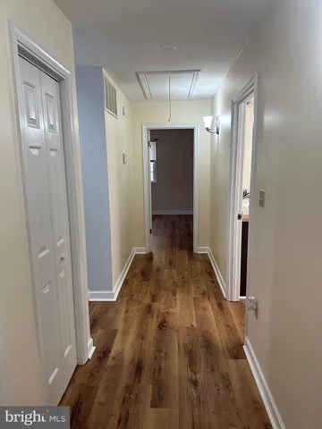 a porch with a table and chairs