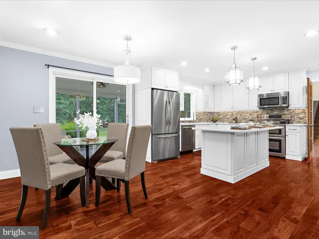 a aerial view of a house with swimming pool and garden