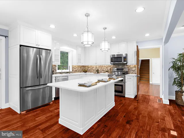 an aerial view of residential house with outdoor space and swimming pool